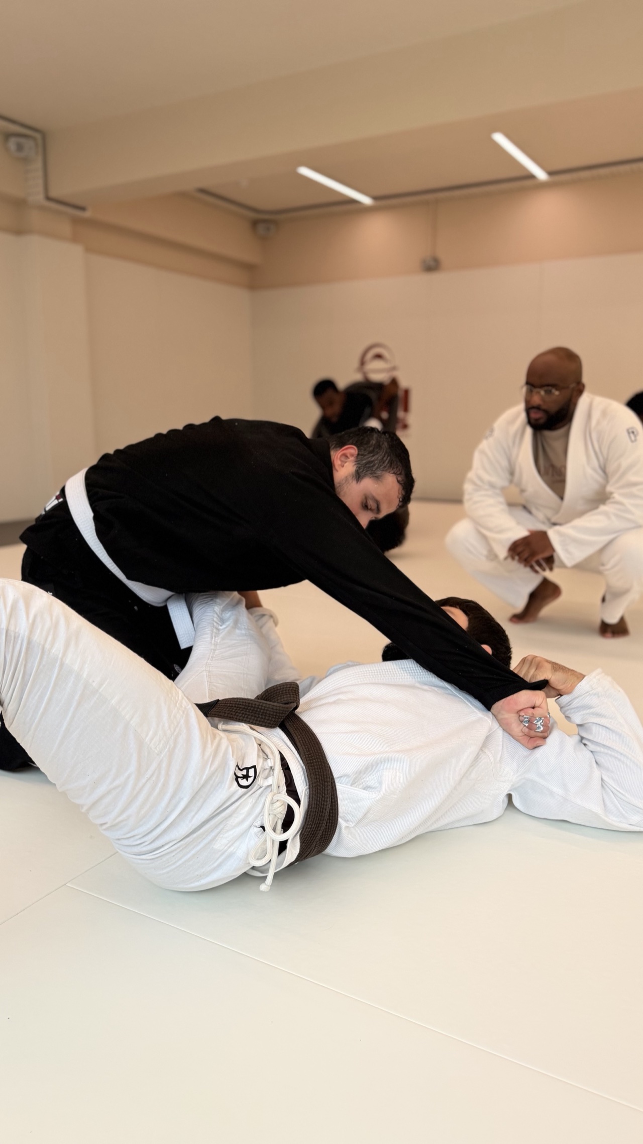 Members training jiu-jitsu on the mat at MOGA